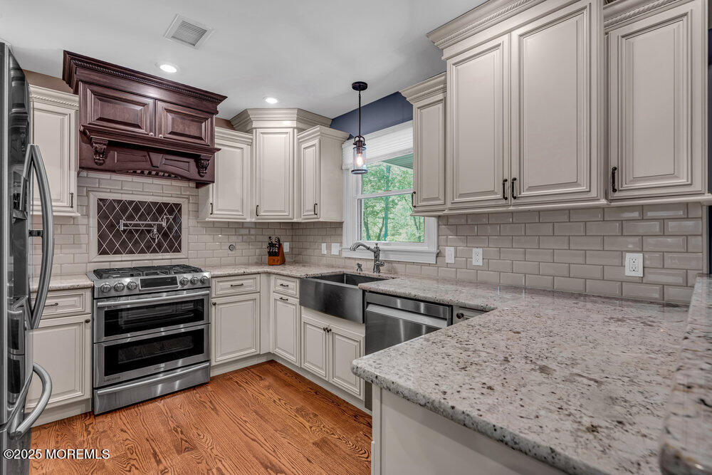 620 Brookside Drive Toms River, NJ 08753 - Photo 12 of 88 a kitchen with stainless steel appliances granite countertop a stove and a sink
