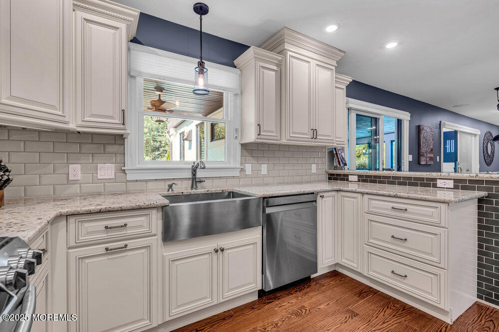 620 Brookside Drive Toms River, NJ 08753 - Photo 14 of 88 a kitchen with cabinets wooden floor and a window