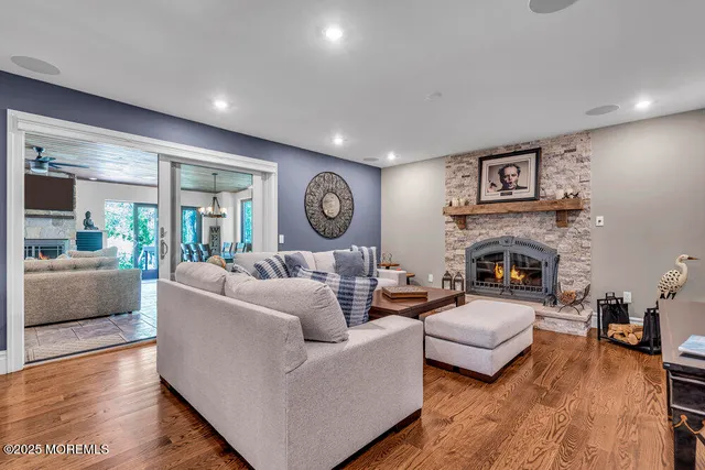 a view of a dining room with furniture wooden floor and chandelier
