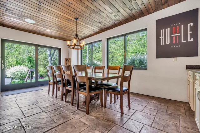 a view of workspace with furniture and a window
