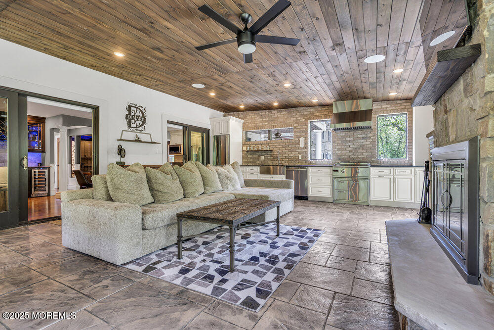 620 Brookside Drive Toms River, NJ 08753 - Photo 28 of 88 a living room with furniture and a fireplace