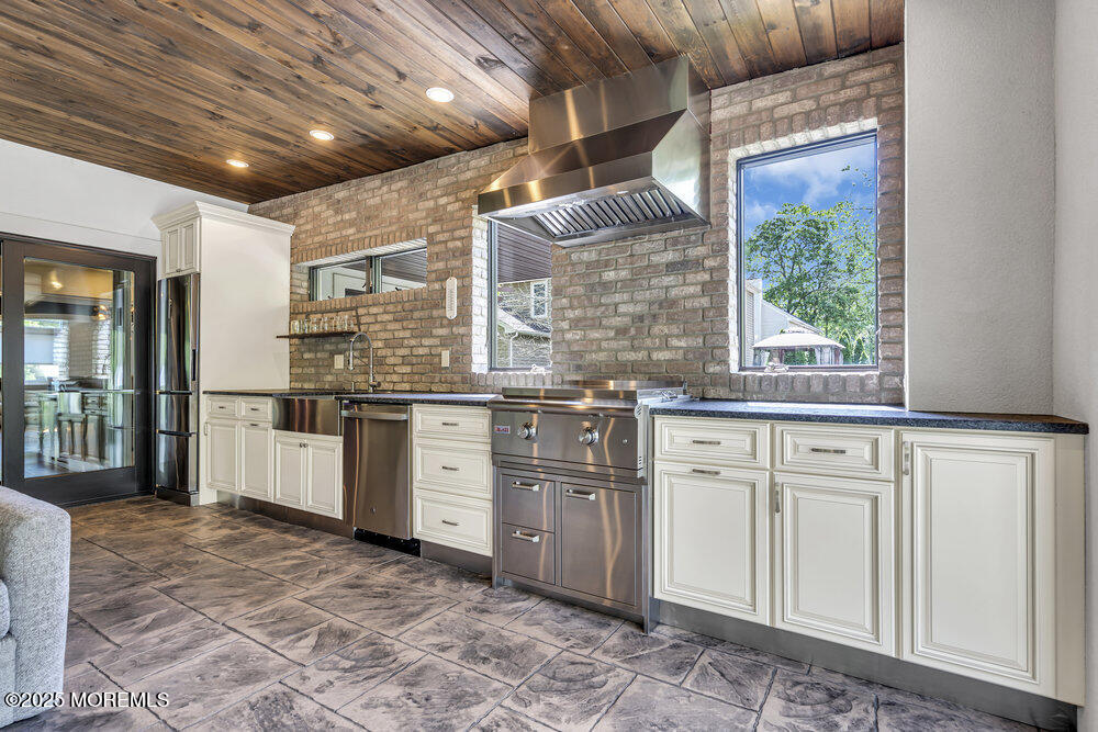620 Brookside Drive Toms River, NJ 08753 - Photo 30 of 88 a kitchen with stainless steel appliances granite countertop a stove a sink and a refrigerator