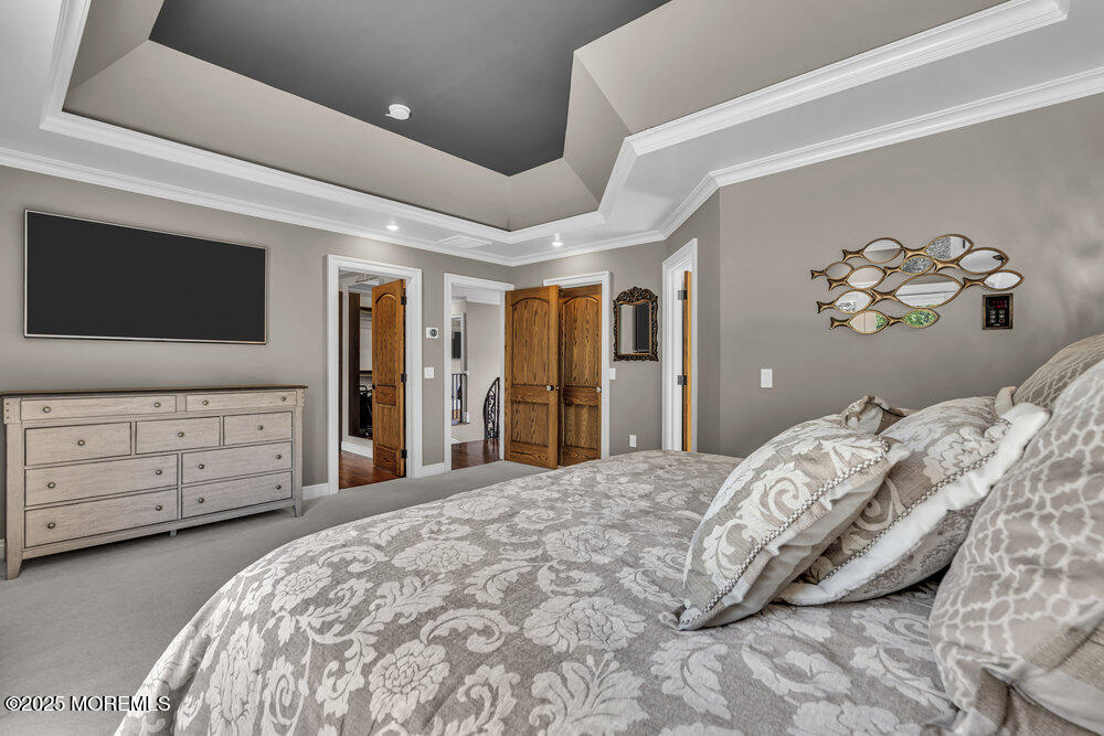 620 Brookside Drive Toms River, NJ 08753 - Photo 34 of 88 a bedroom with a bed and a flat screen tv