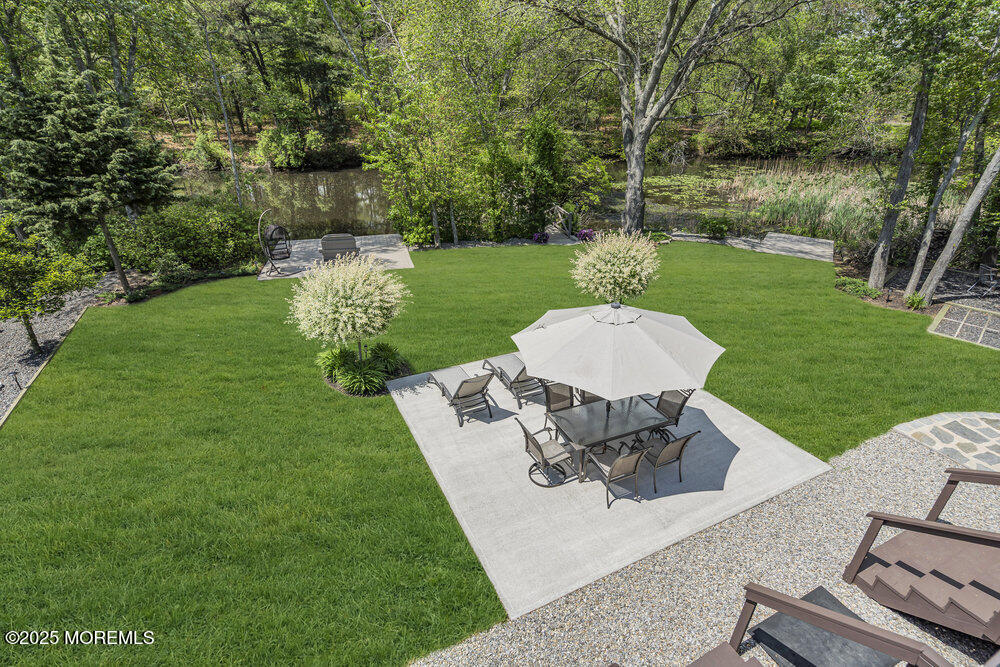 620 Brookside Drive Toms River, NJ 08753 - Photo 43 of 88 a view of a table and chairs in the garden