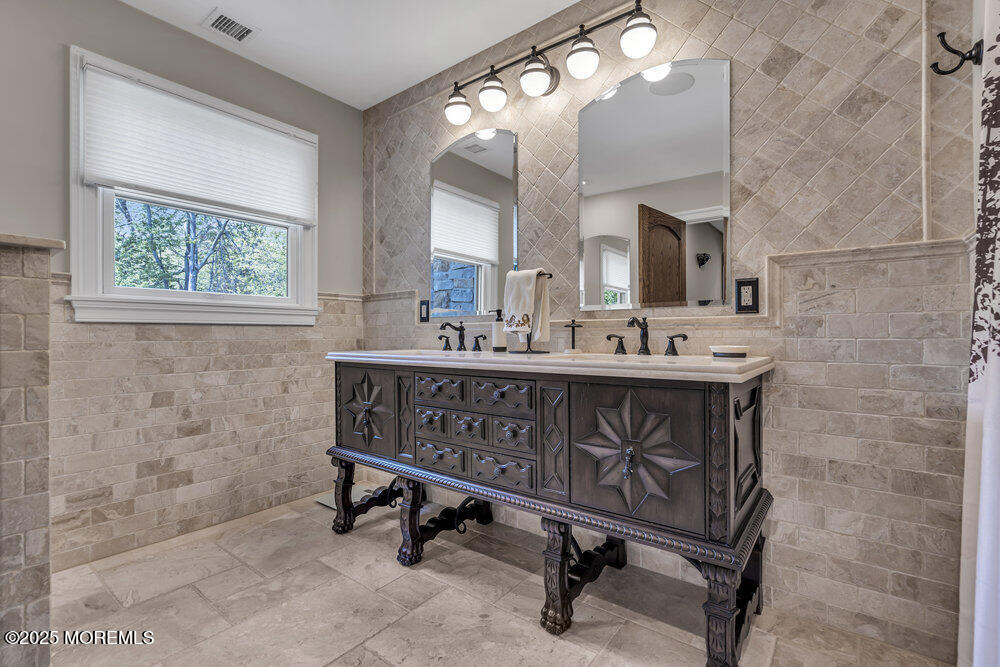 620 Brookside Drive Toms River, NJ 08753 - Photo 47 of 88 a bathroom with a sink a mirror and a bathtub