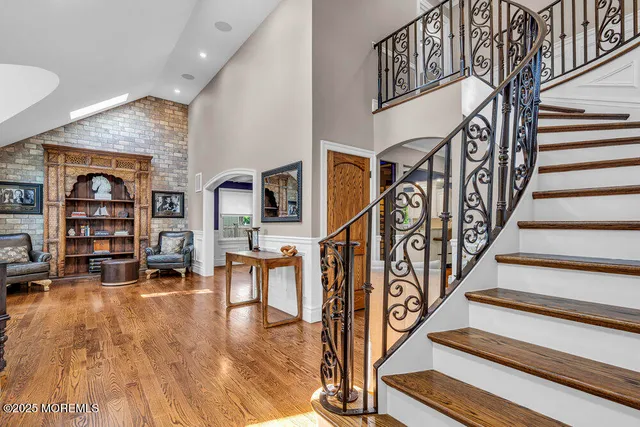 a dining room with furniture and wooden floor