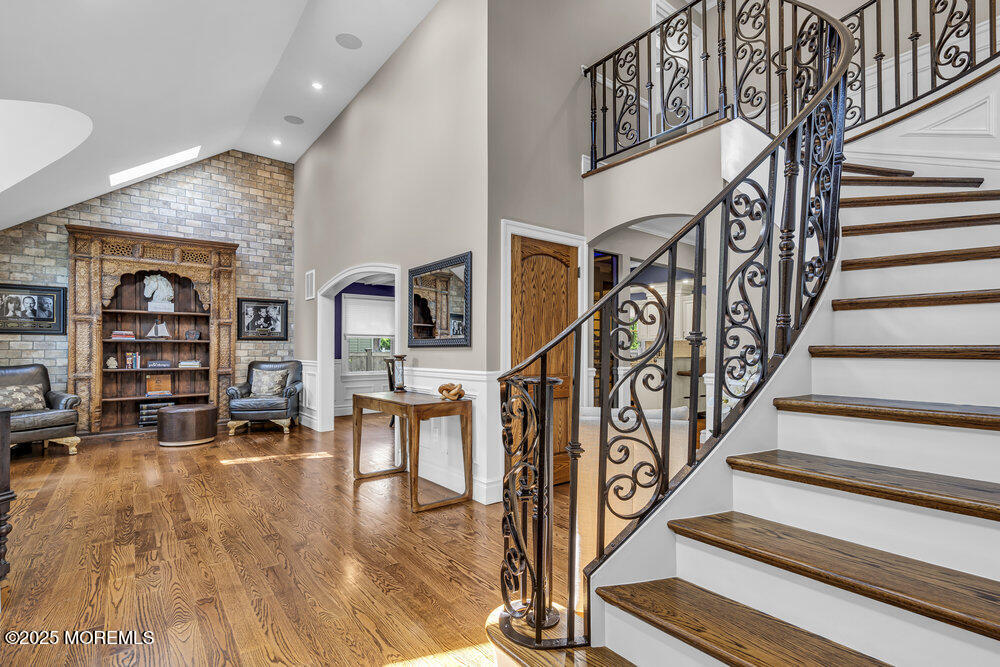 620 Brookside Drive Toms River, NJ 08753 - Photo 5 of 88 a view of staircase with lots of frames on wall and a dining table