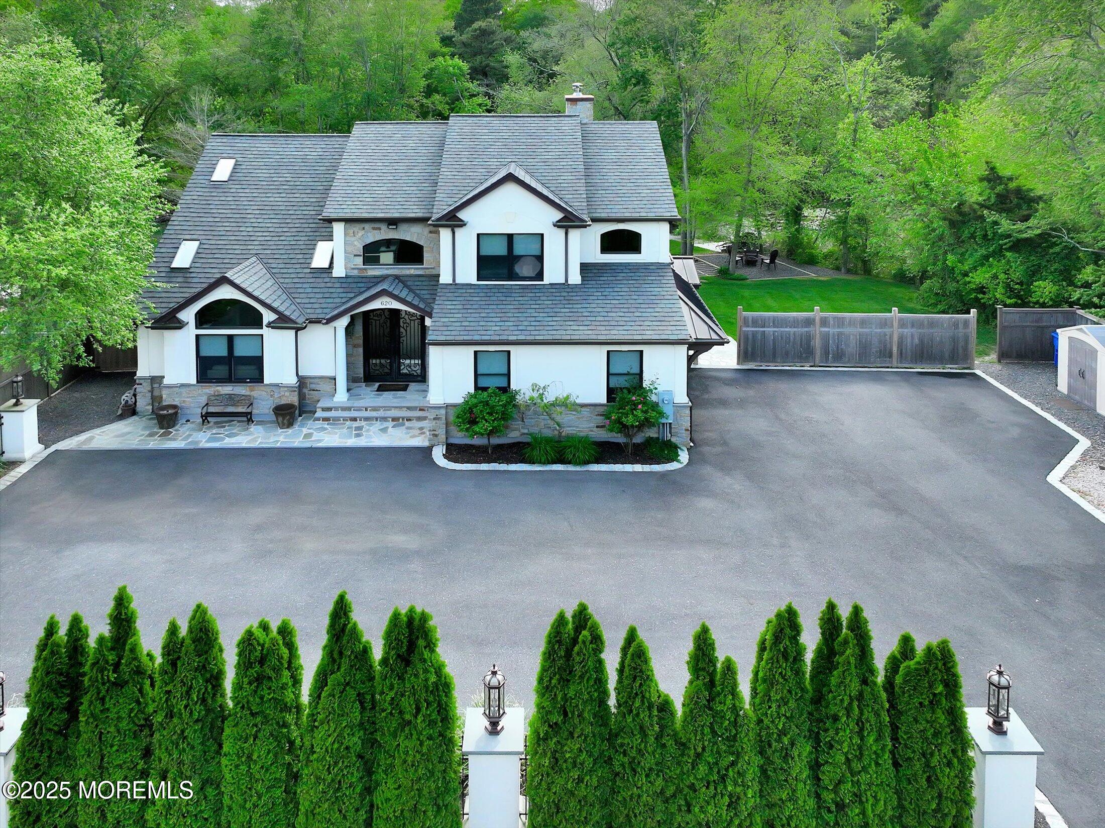 620 Brookside Drive Toms River, NJ 08753 - Photo 67 of 88 a front view of a house with a yard and trees