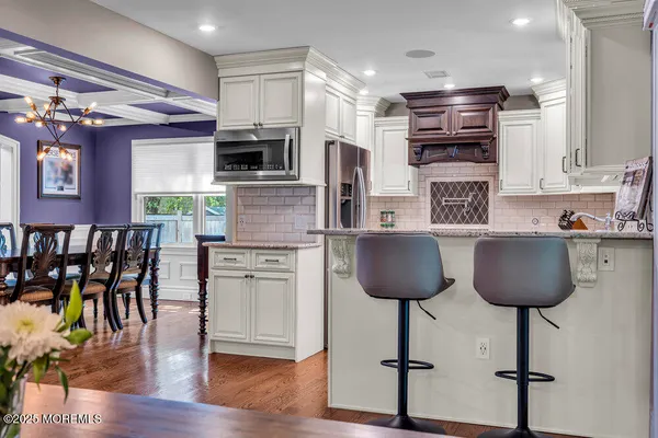a kitchen with stainless steel appliances granite countertop a stove and a sink