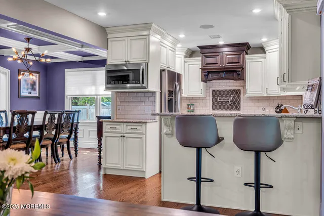 a kitchen with stainless steel appliances granite countertop a stove and a sink