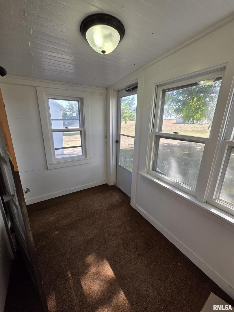13600 Kennedy Road Fulton, IL 61252 - Photo 15 of 42 a view of an empty room with a window