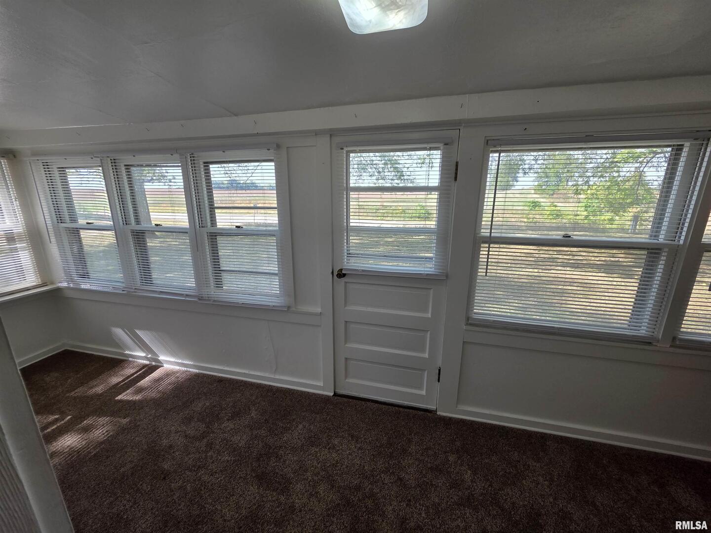 13600 Kennedy Road Fulton, IL 61252 - Photo 3 of 42 a view of an empty room and window