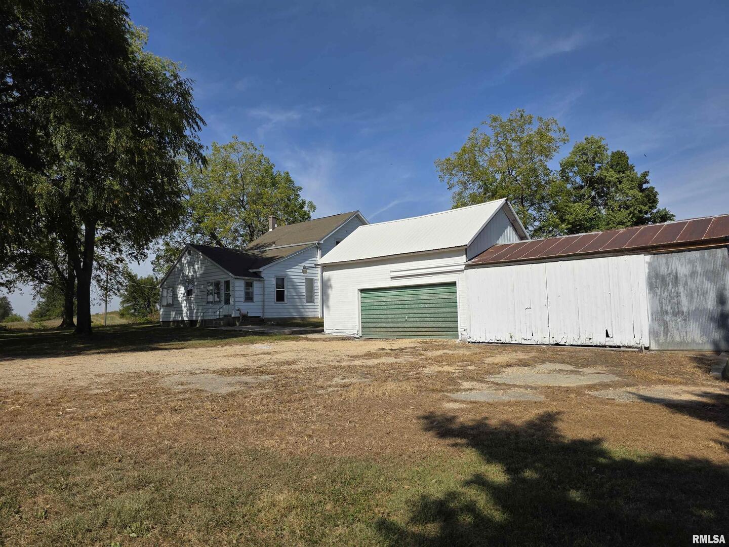 13600 Kennedy Road Fulton, IL 61252 - Photo 32 of 42 a view of a house with a yard and garage