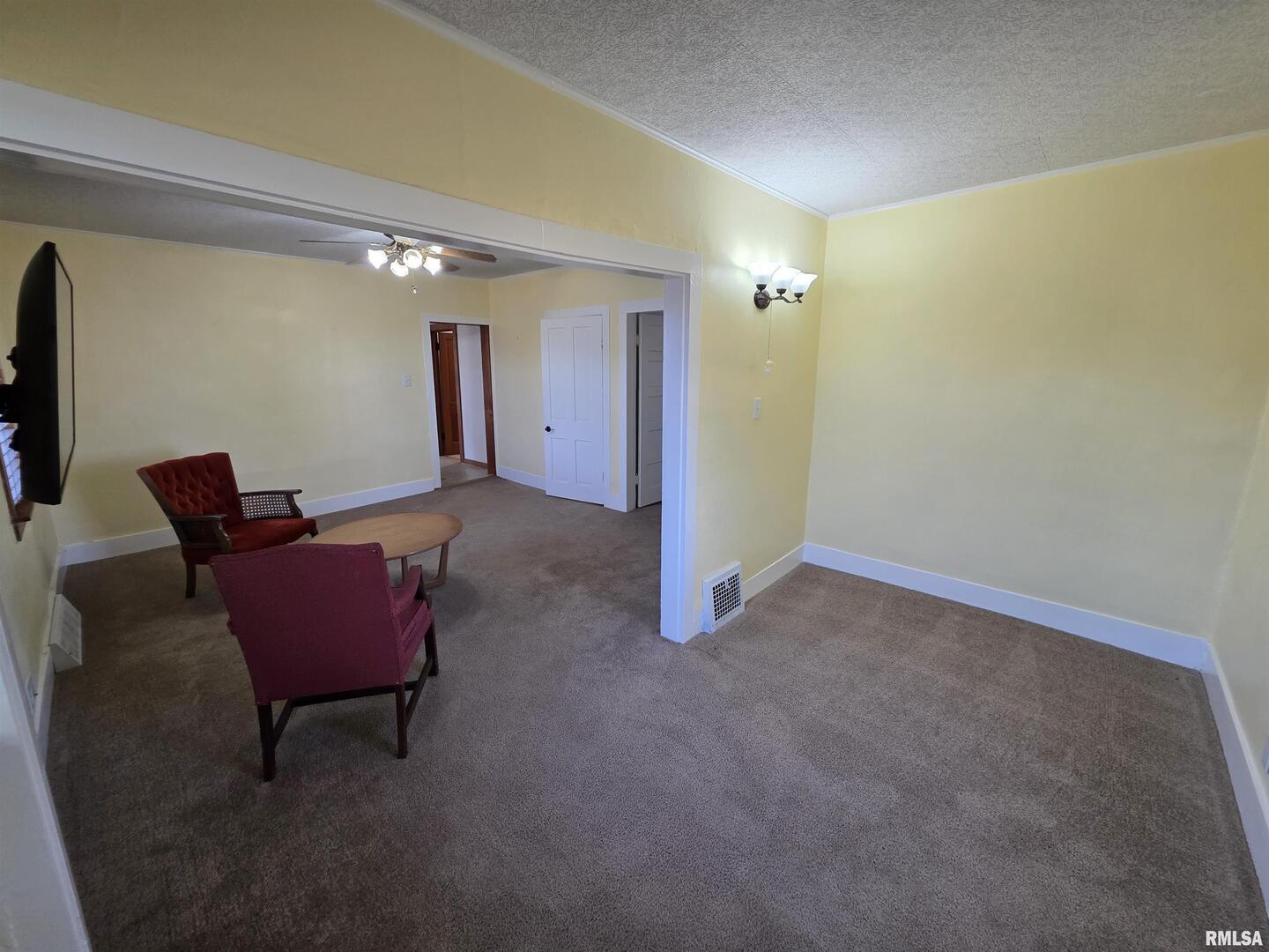 13600 Kennedy Road Fulton, IL 61252 - Photo 9 of 42 a view of a livingroom with chairs and a couch