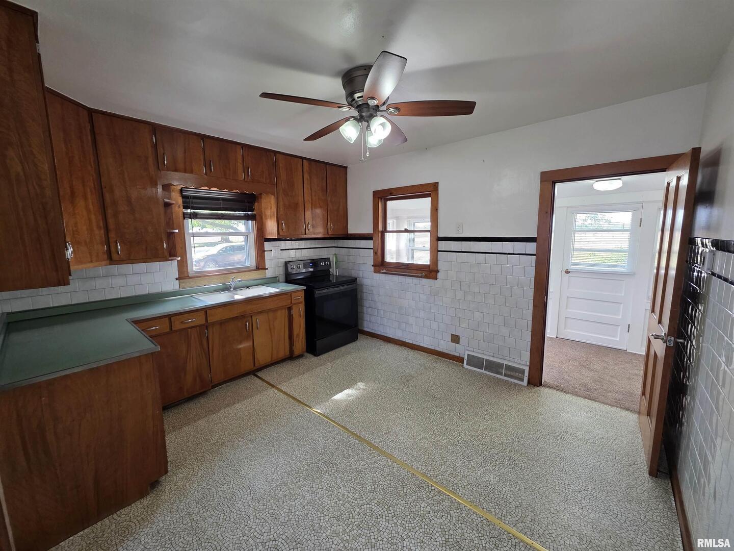 13600 Kennedy Road Fulton, IL 61252 - Photo 10 of 42 a kitchen with kitchen island granite countertop stainless steel appliances a sink stove top oven and cabinets