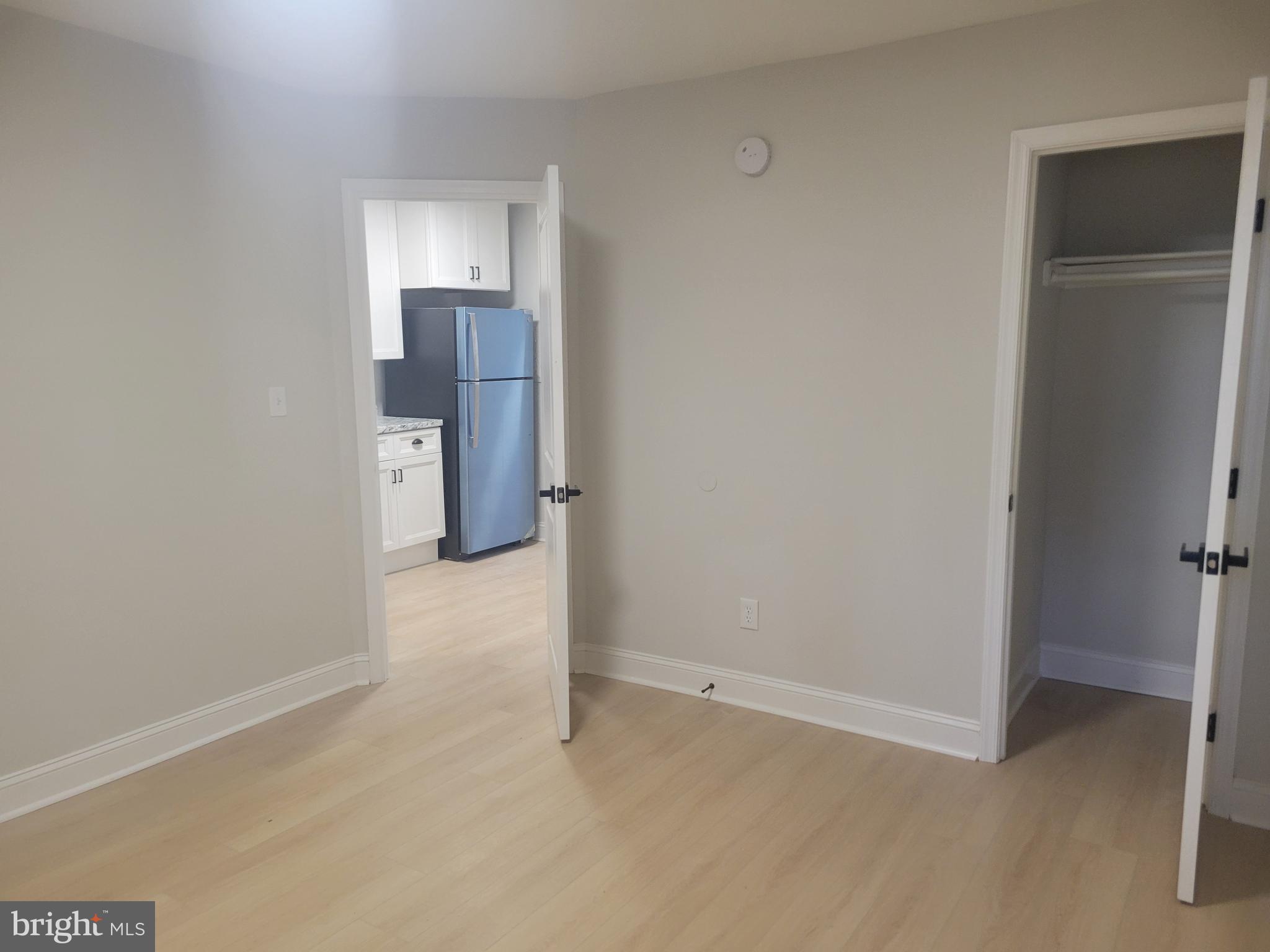 1250 Queen Street Northeast, Unit 1 Washington, DC 20002 - Photo 6 of 13 an empty room with closet and windows