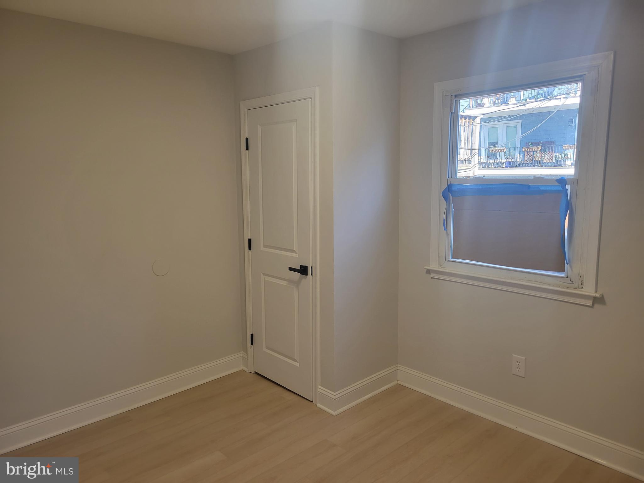 1250 Queen Street Northeast, Unit 1 Washington, DC 20002 - Photo 8 of 13 an empty room with windows