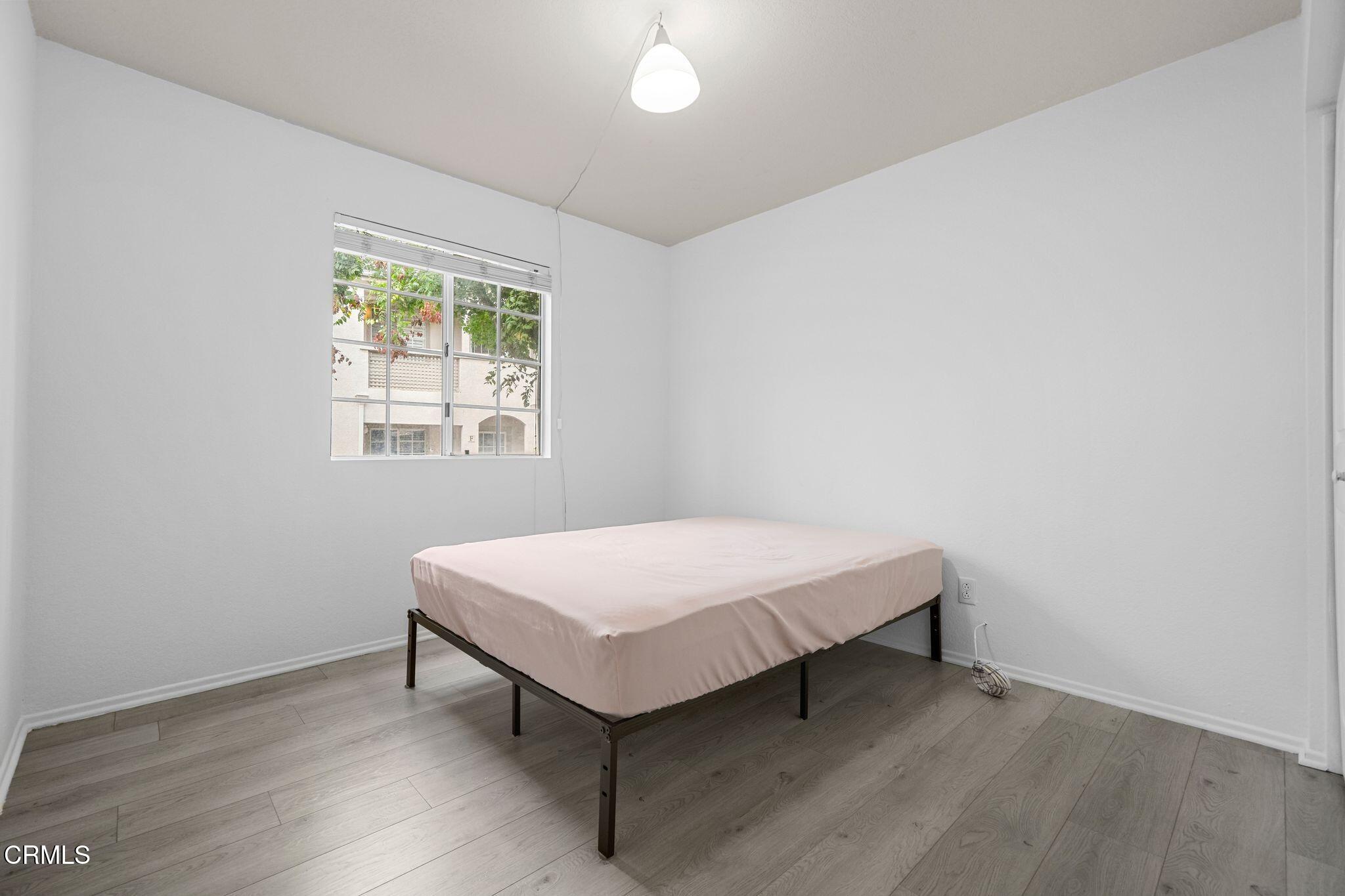 1195 Fitzgerald Road, Unit C Simi Valley, CA 93065 - Photo 11 of 26 a room with a bed and a window