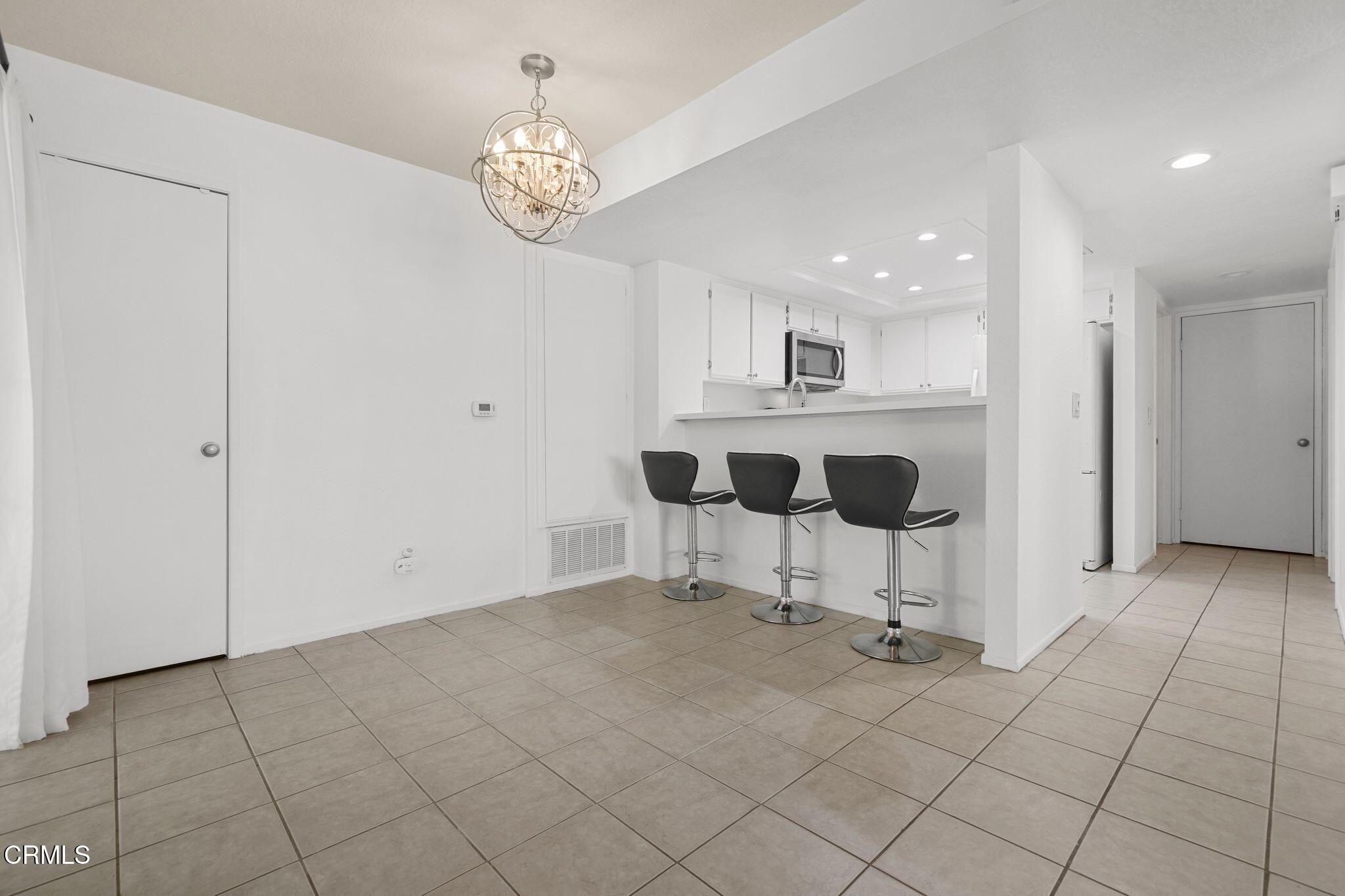1195 Fitzgerald Road, Unit C Simi Valley, CA 93065 - Photo 18 of 26 a view of kitchen with furniture and chandelier