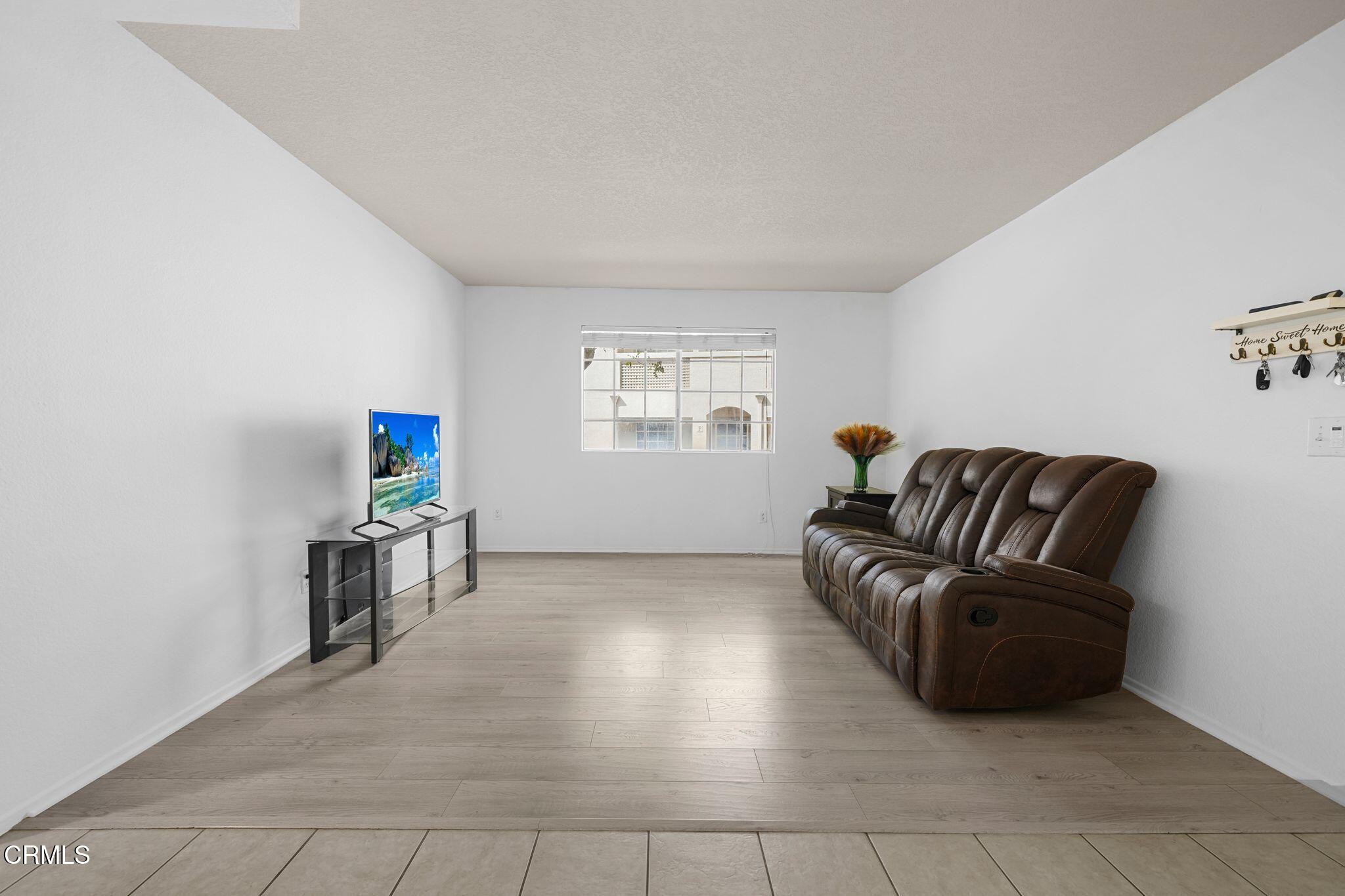 1195 Fitzgerald Road, Unit C Simi Valley, CA 93065 - Photo 20 of 26 a living room with furniture and a window