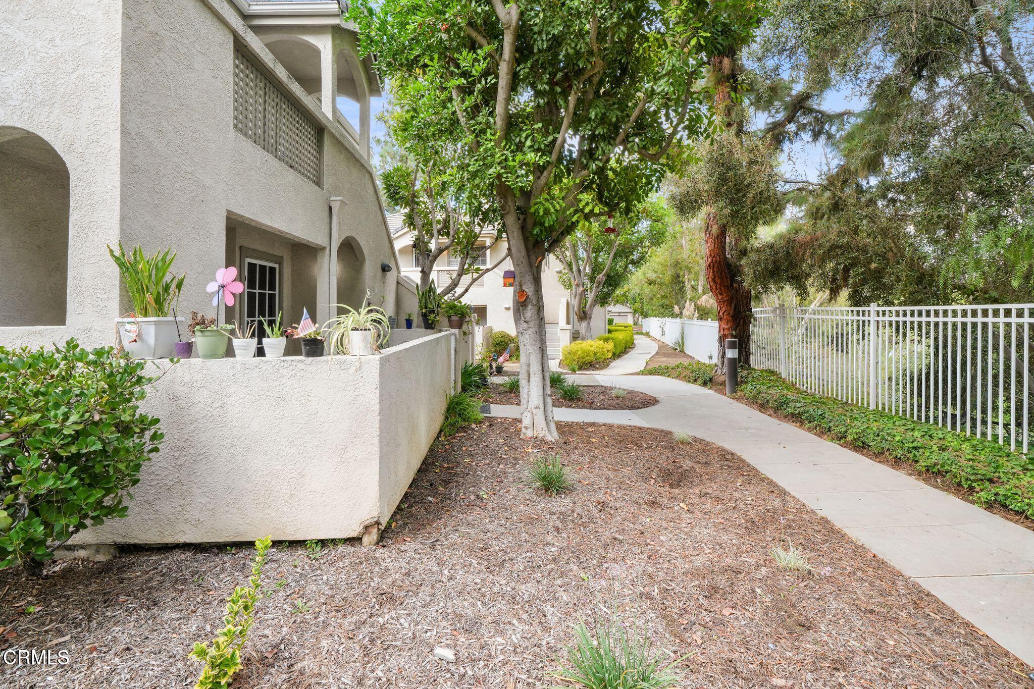 1195 Fitzgerald Road, Unit C Simi Valley, CA 93065 - Photo 2 of 26 a view of a house with a yard and sitting area