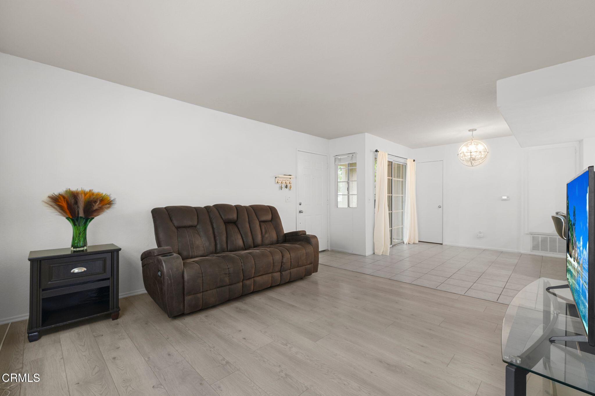 1195 Fitzgerald Road, Unit C Simi Valley, CA 93065 - Photo 22 of 26 a living room with furniture and a lamp