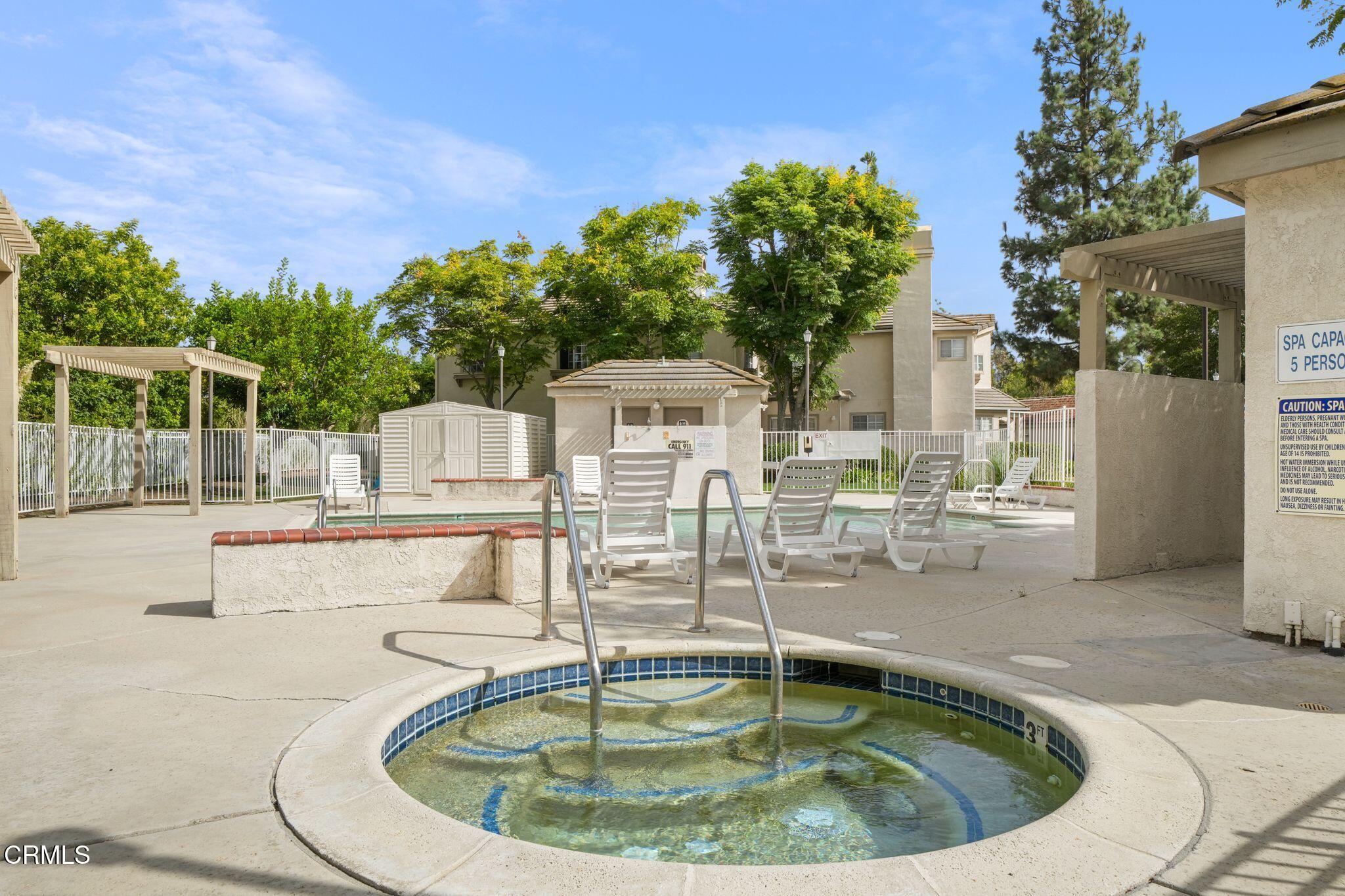 1195 Fitzgerald Road, Unit C Simi Valley, CA 93065 - Photo 24 of 26 a view of a swimming pool with a patio