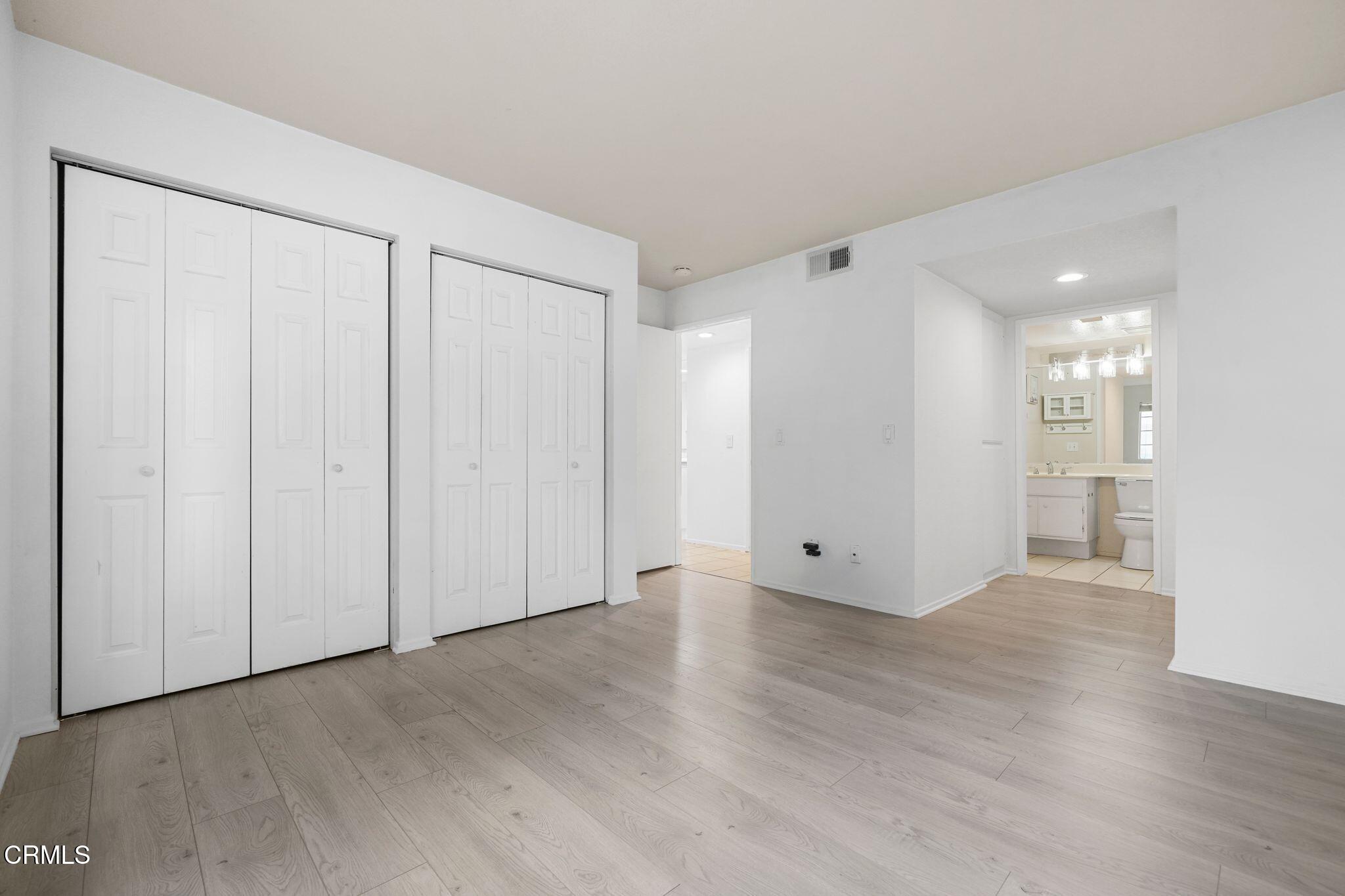 1195 Fitzgerald Road, Unit C Simi Valley, CA 93065 - Photo 6 of 26 a view of an empty room with wooden floor