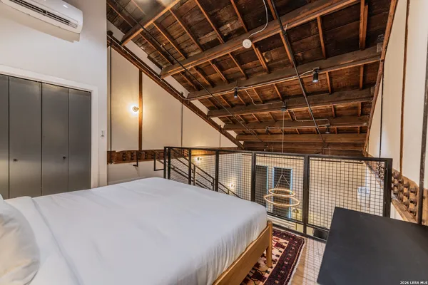a bed room with a bed and a walk in closet