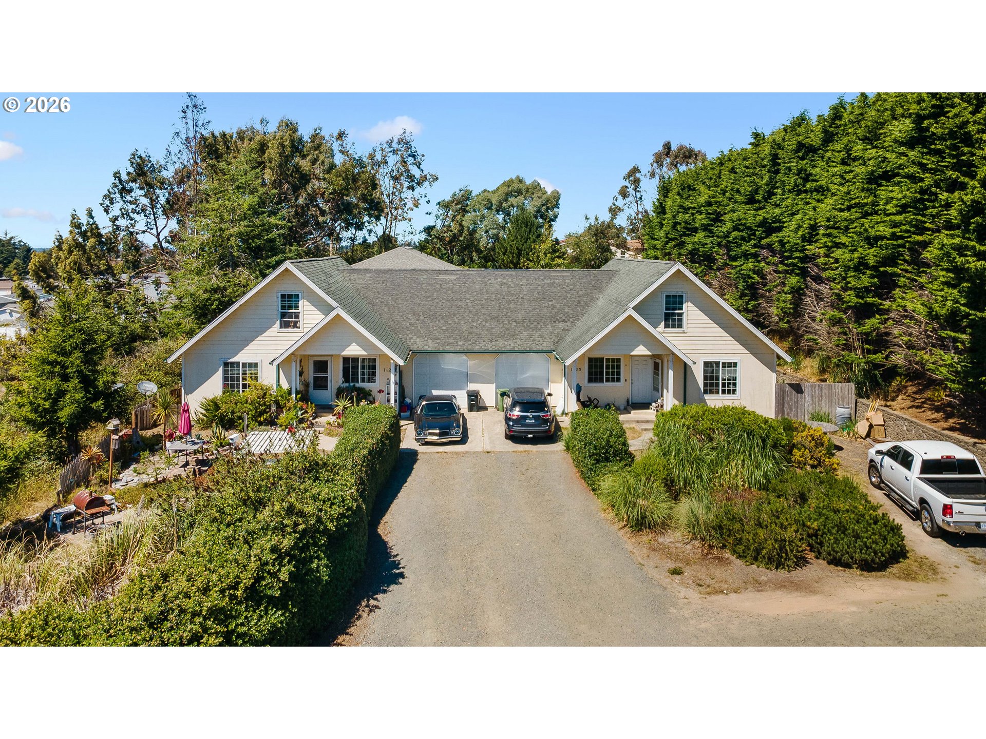 1123 South Morrison Street Coos Bay, OR 97420 - Photo 1 of 47 a aerial view of a house with a yard and potted plants