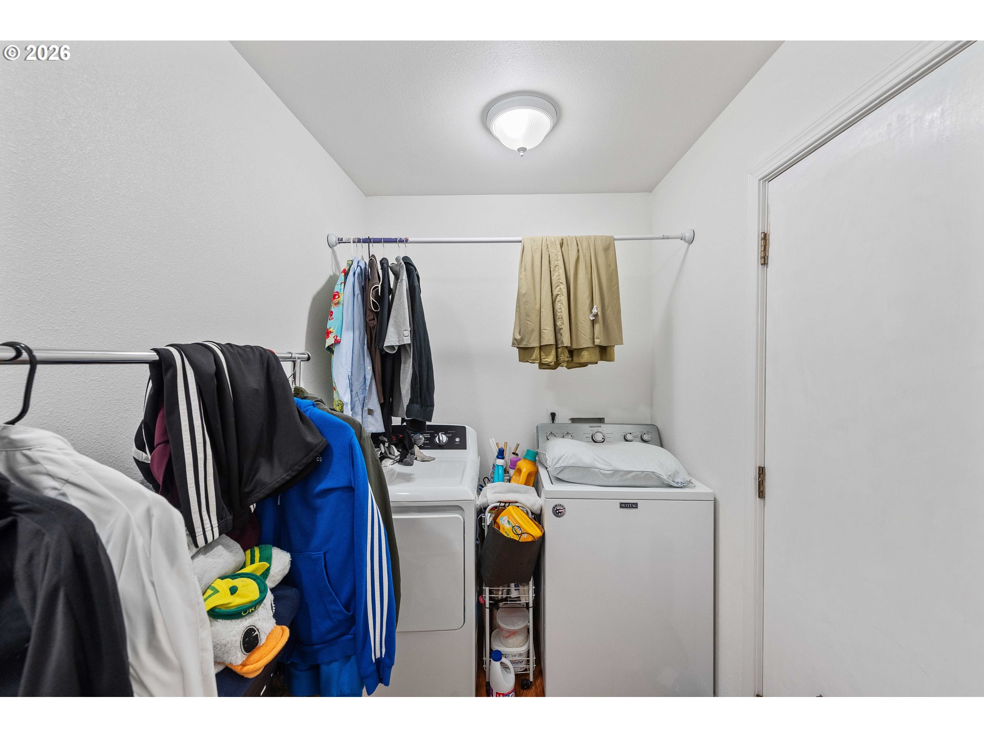 1123 South Morrison Street Coos Bay, OR 97420 - Photo 12 of 47 a view of walk in closet with clothes and shoes