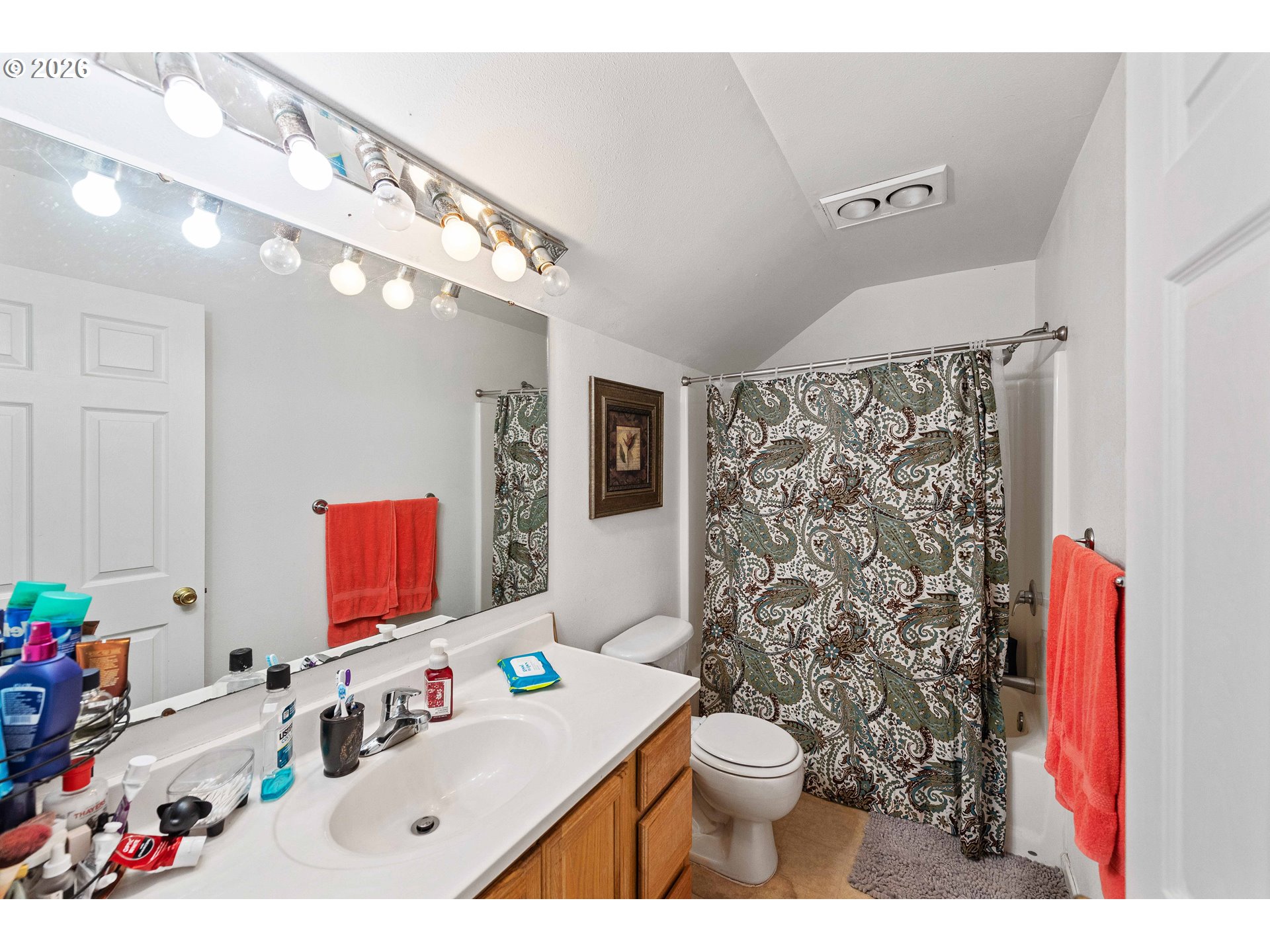 1123 South Morrison Street Coos Bay, OR 97420 - Photo 18 of 47 a bathroom with a sink vanity mirror and toilet