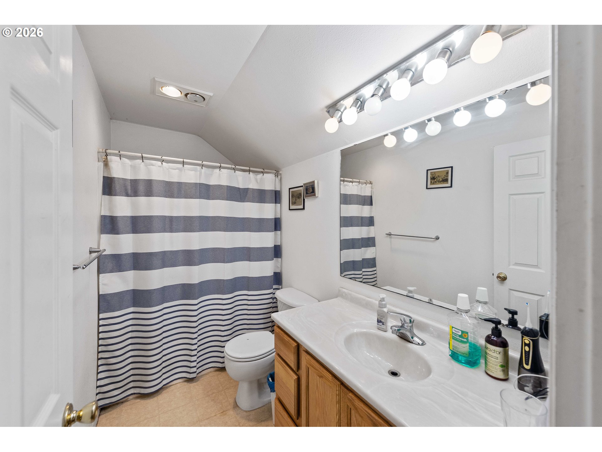 1123 South Morrison Street Coos Bay, OR 97420 - Photo 42 of 47 a bathroom with a sink and a mirror