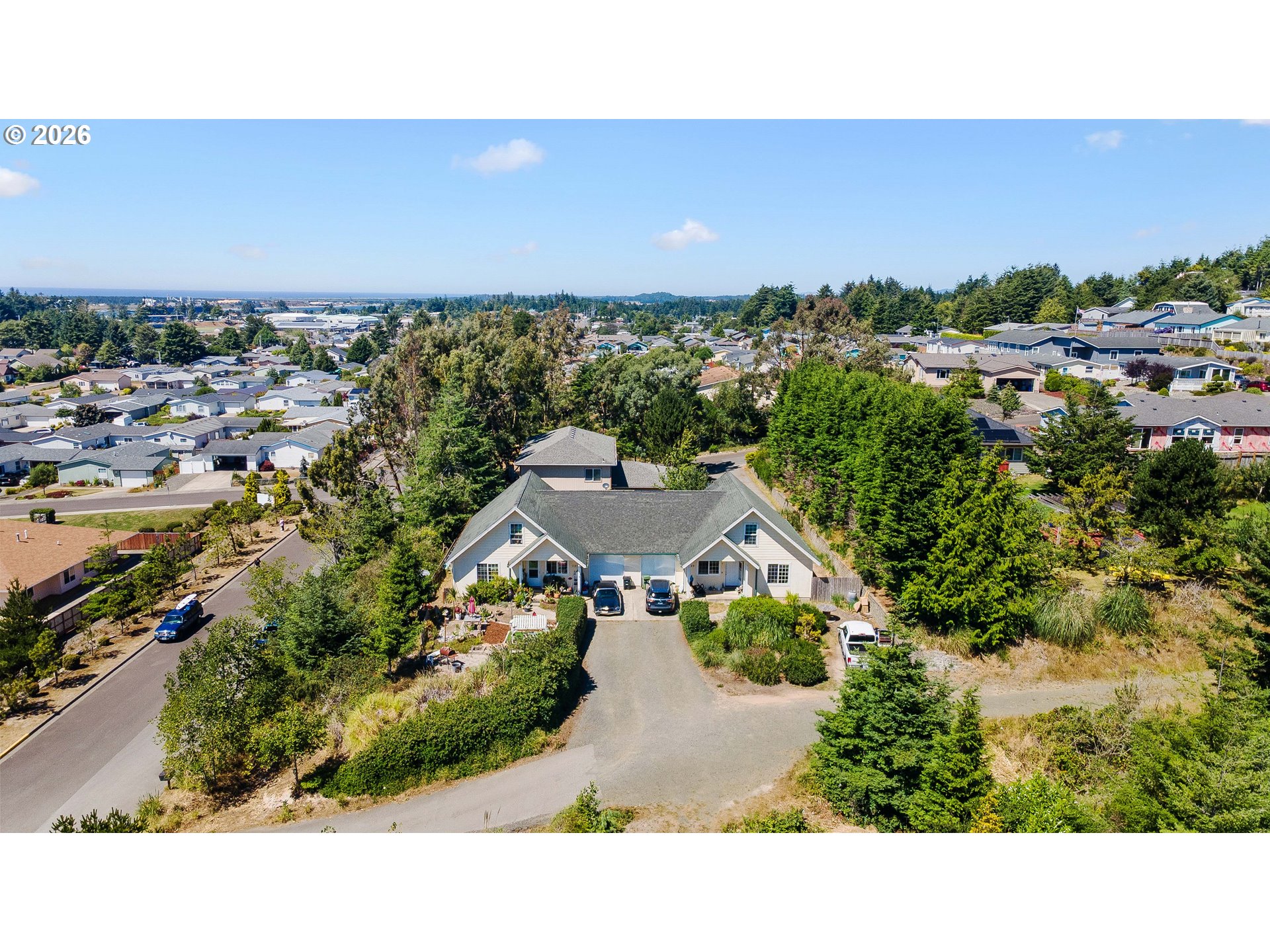 1123 South Morrison Street Coos Bay, OR 97420 - Photo 45 of 47 an aerial view of a house with a yard and lake view in back