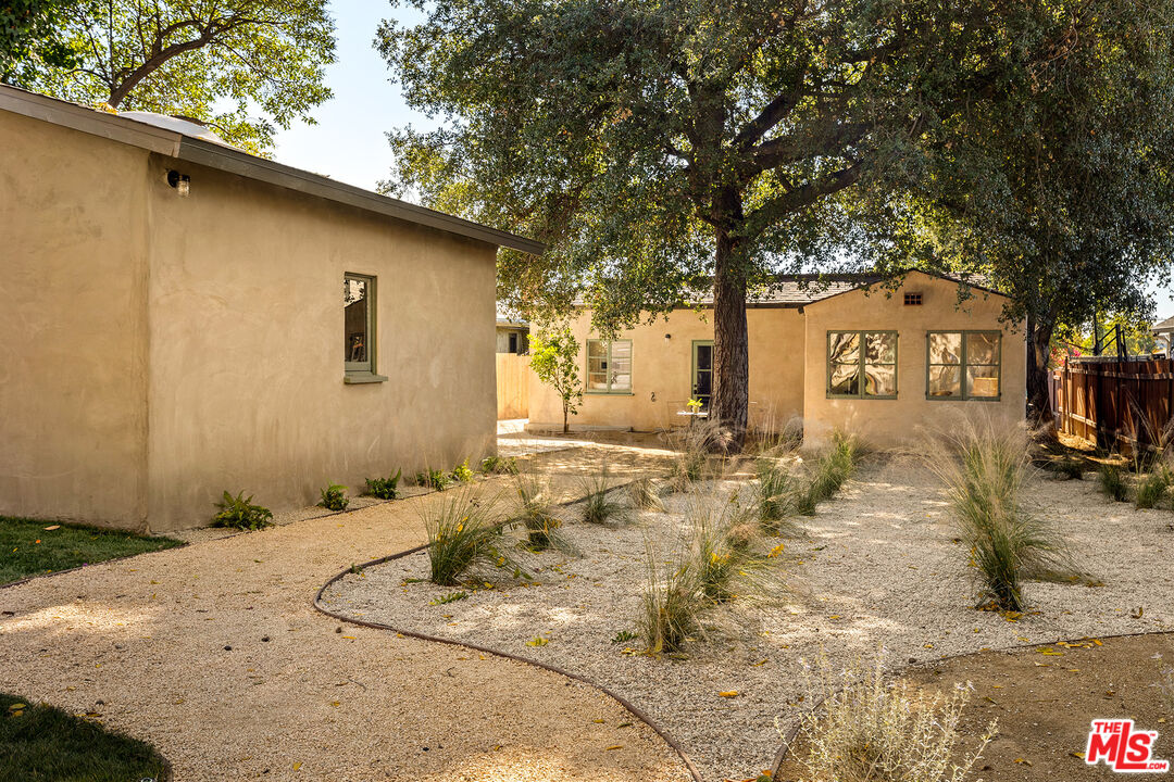 585 Mountain View Street Altadena, CA 91001 - Photo 22 of 31 a front view of a house with a yard