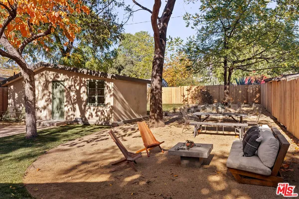 a view of a backyard with a patio
