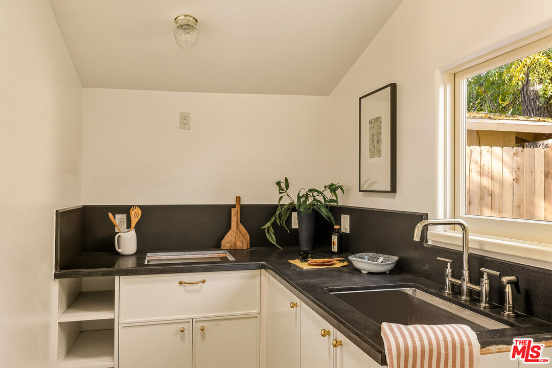 585 Mountain View Street Altadena, CA 91001 - Photo 27 of 31 a kitchen with a sink and a stove top oven