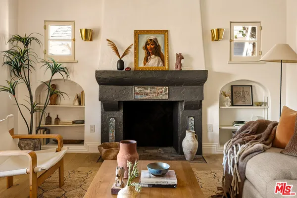 a living room with furniture and a fireplace