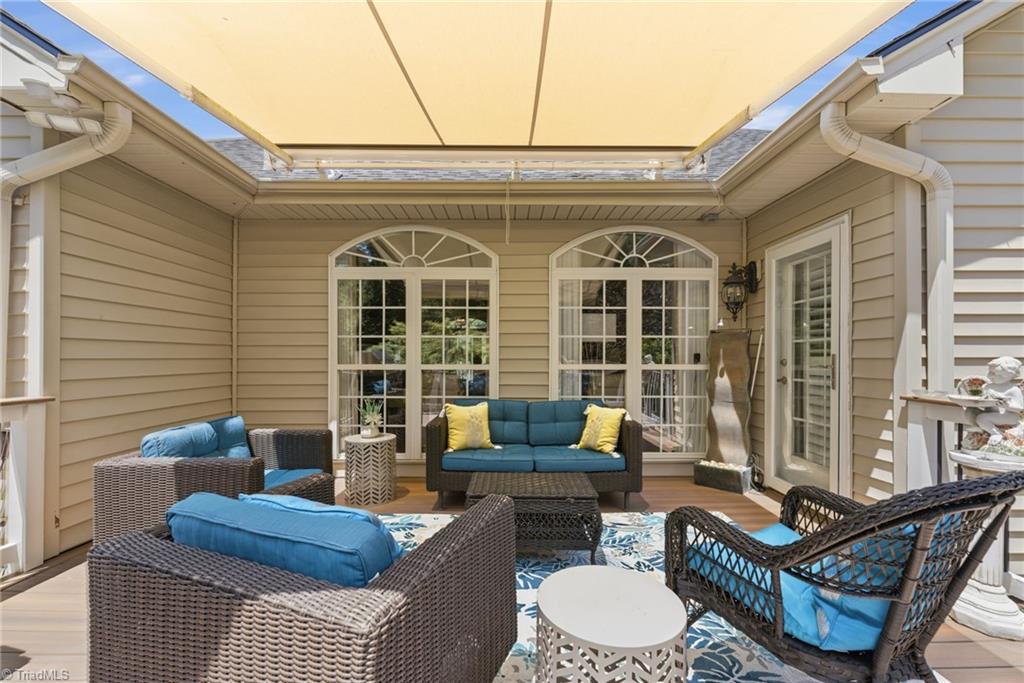 4253 Wayne Road Greensboro, NC 27407 - Photo 36 of 49 Deck with retractable awning