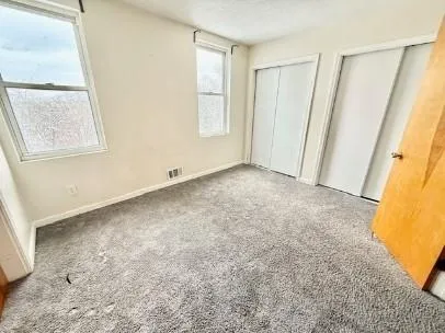 an empty room with windows