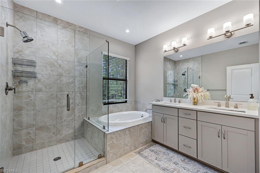 7348 Rockefeller Drive Naples, FL 34119 - Photo 18 of 39 Master Bathroom - Featuring a Spacious Shower, Soaking Tub, and Dual Sinks