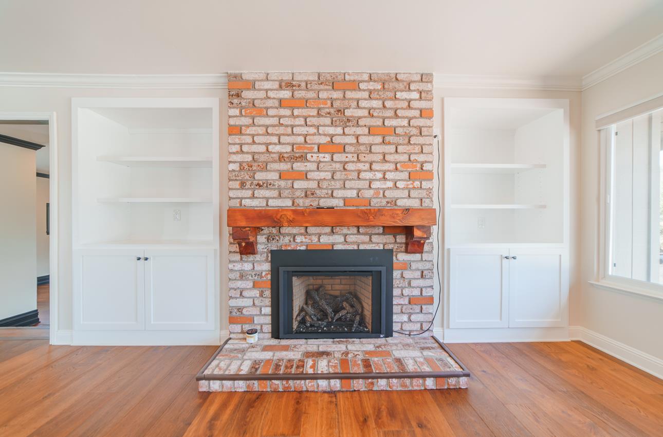 22125 Ranchito Drive Salinas, CA 93908 - Photo 20 of 66 a living room with a fireplace and wooden floor