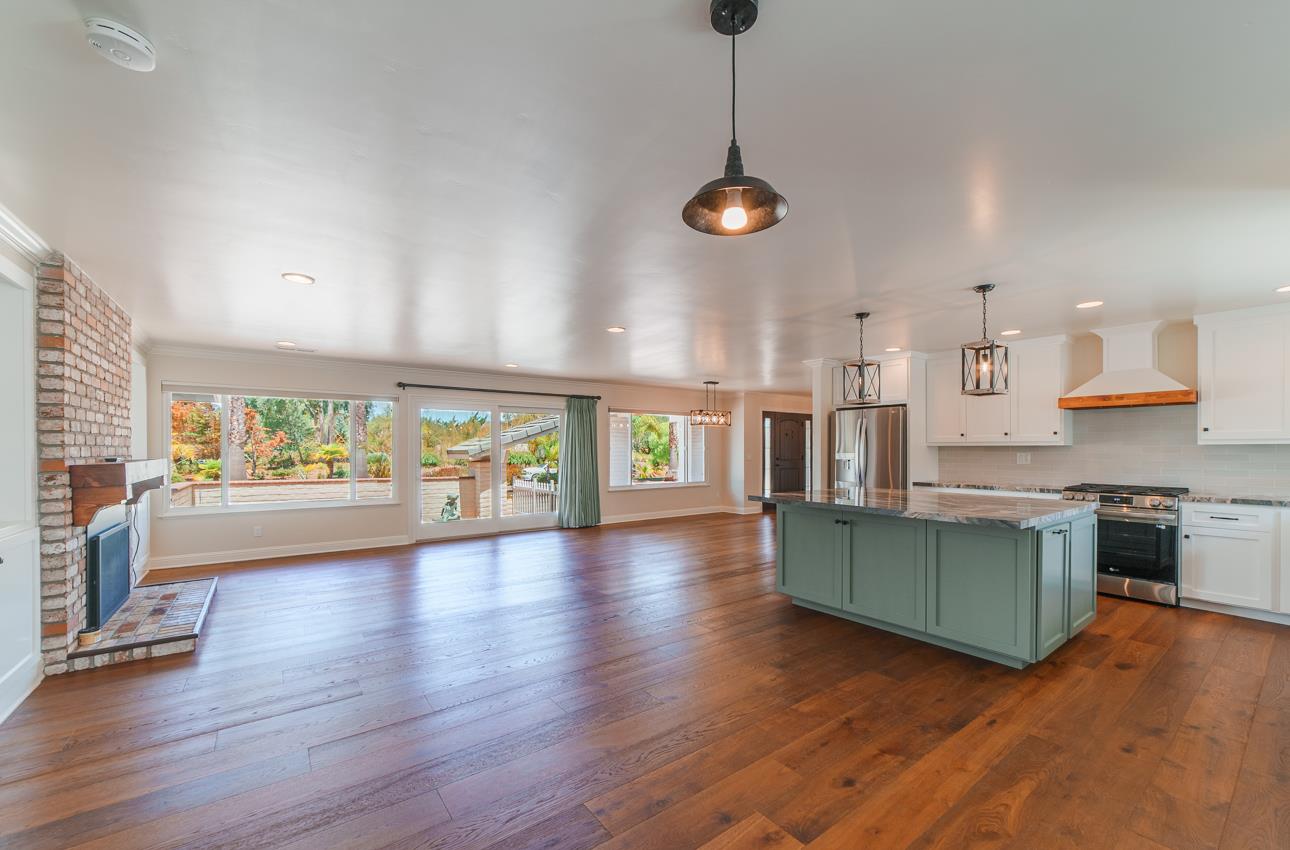 22125 Ranchito Drive Salinas, CA 93908 - Photo 22 of 66 a view of a living room and kitchen with furniture wooden floor and windows