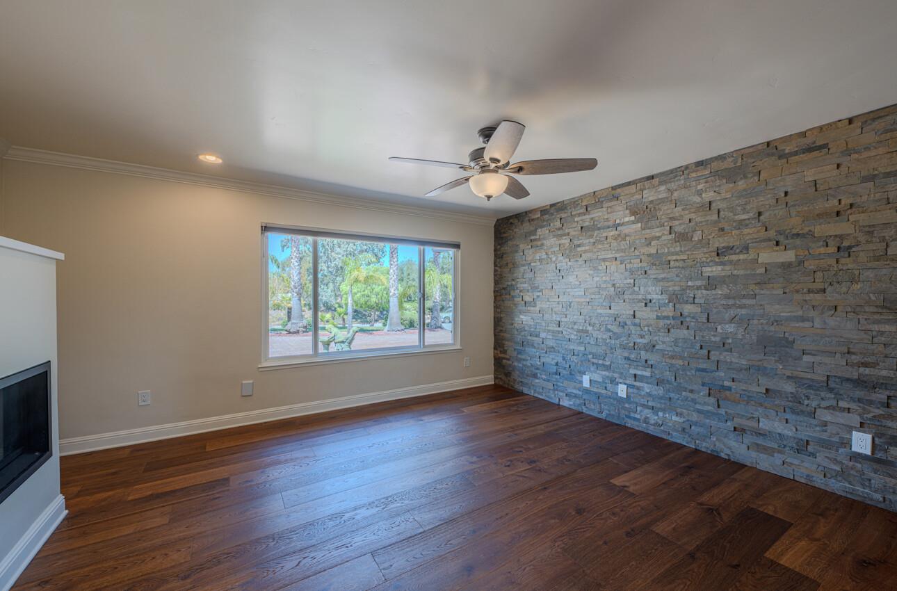 22125 Ranchito Drive Salinas, CA 93908 - Photo 30 of 66 a view of an empty room with a window and wooden floor
