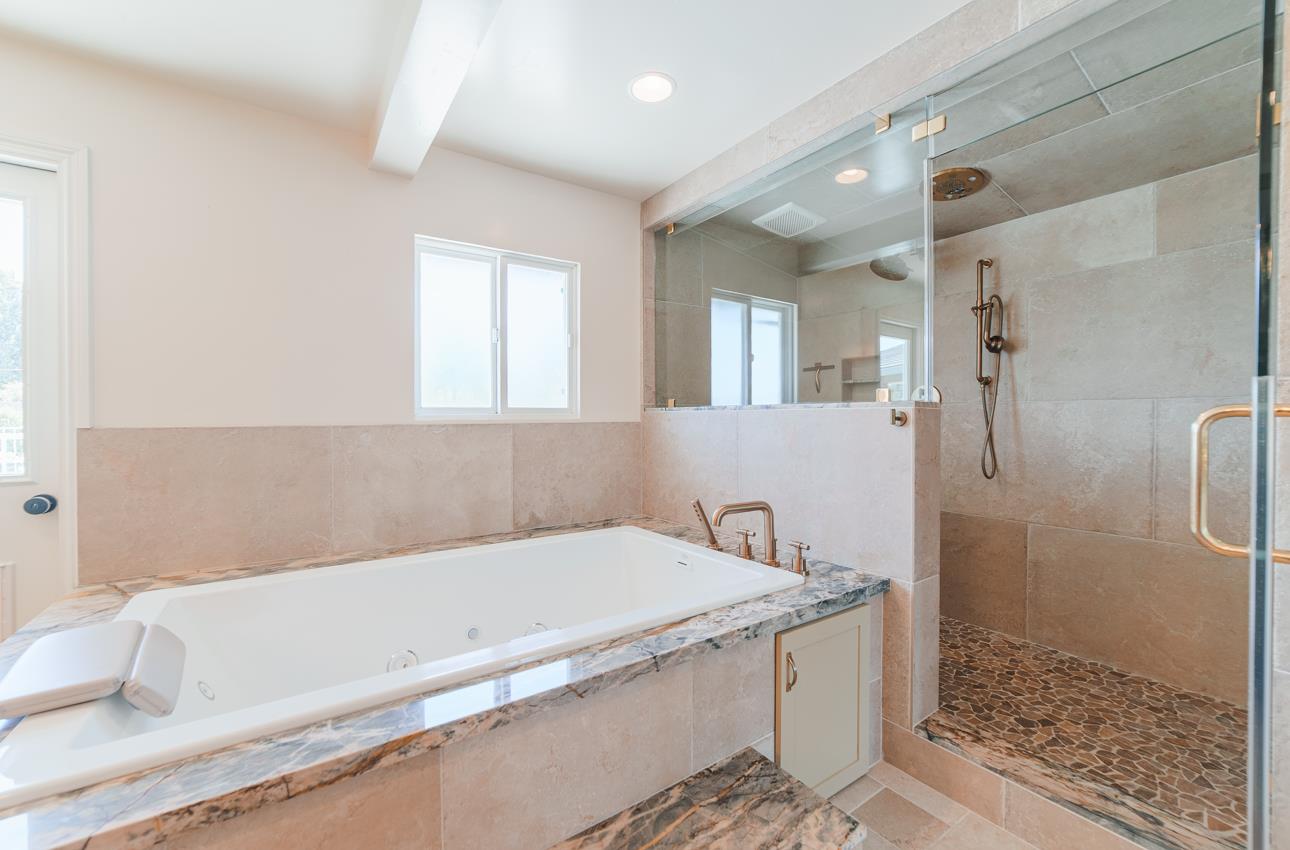 22125 Ranchito Drive Salinas, CA 93908 - Photo 35 of 66 a bathroom with a bathtub and a shower