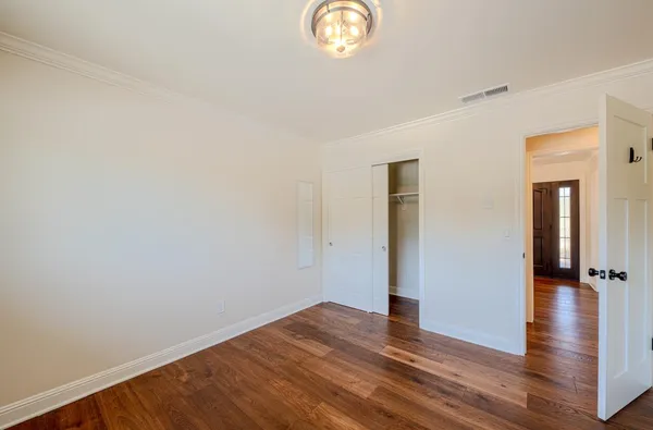 a outdoor sitting area with a couch and a garden
