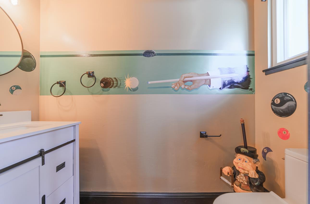 22125 Ranchito Drive Salinas, CA 93908 - Photo 47 of 66 a bathroom with a window a sink and cabinets