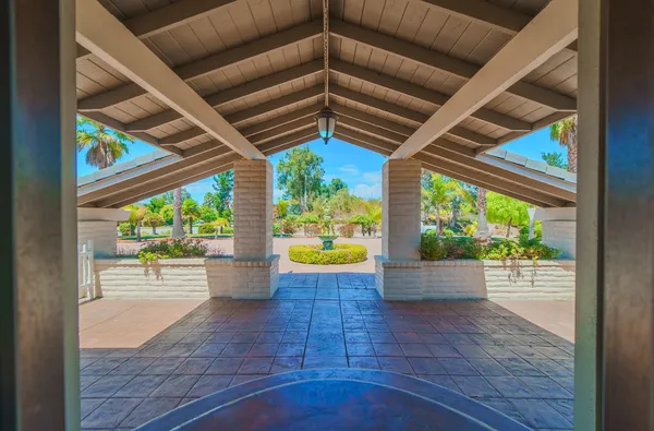 a view of a house with a yard porch and sitting area