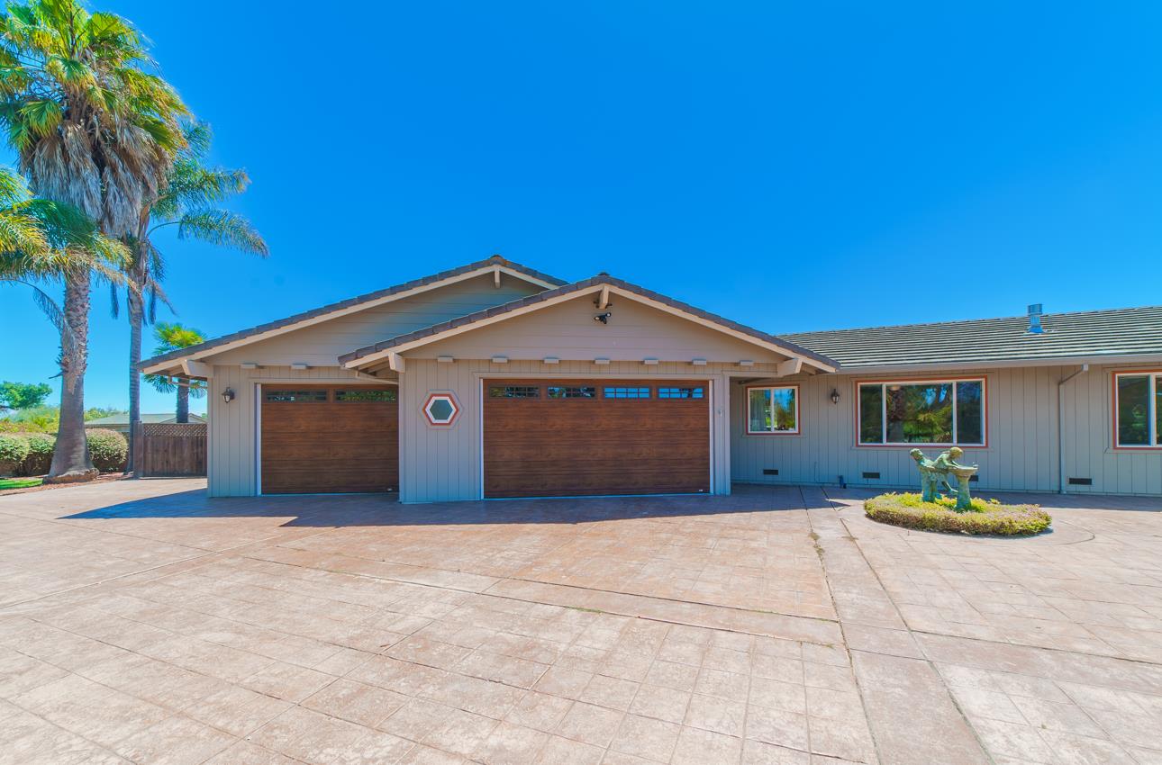 22125 Ranchito Drive Salinas, CA 93908 - Photo 60 of 66 a front view of a house with a yard and garage