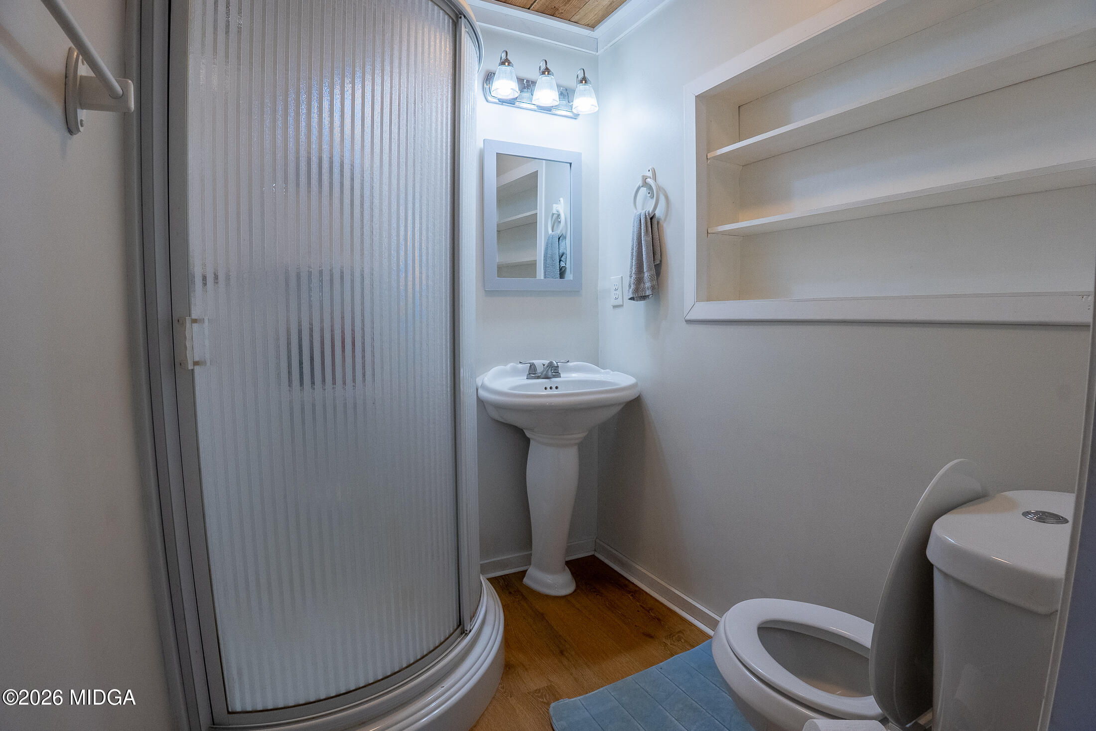 199 Cherokee Drive Jackson, GA 30233 - Photo 11 of 25 a bathroom with a sink toilet and a mirror